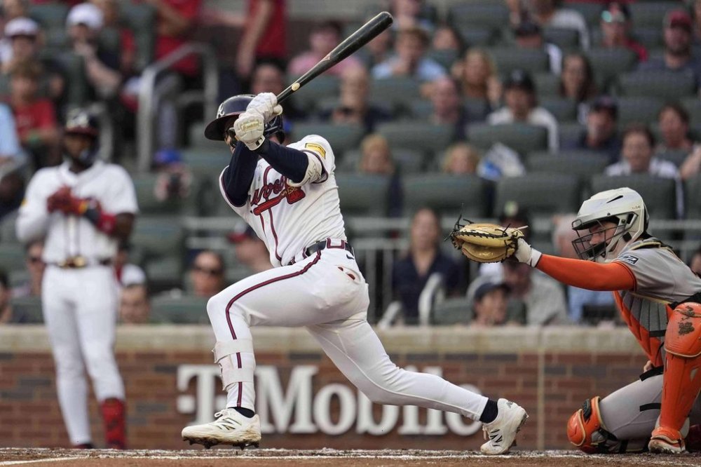Atlanta Braves' Drake Baldwin (30) hits a two-RBI single against the San Francisco Giants in the first inning of a baseball game, Monday, July 21, 2025, in Atlanta. (AP Photo/Mike Stewart)