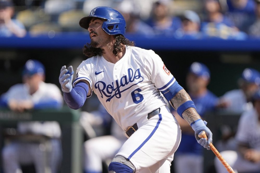 Kansas City Royals' Jonathan India watches his three-run home run to win the game during the 10th inning in the first baseball game of a doubleheader against the Cleveland Guardians, Saturday, July 26, 2025, in Kansas City, Mo. (AP Photo/Charlie Riedel)