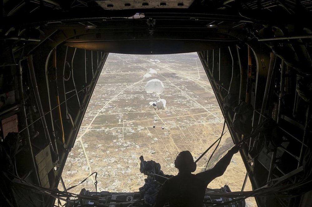 Humanitarian aid destined for Palestinians is airdropped over the Gaza Strip by a Jordanian Air Force aircraft on Tuesday, July 29, 2025. (AP Photo/Malak Harb)