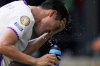 FILE - Al Ain's Park Yong-woo splashes his face to cool off during the Club World Cup Group G soccer match between Wydad AC and Al Ain FC in Washington, June 26, 2025. (AP Photo/Julia Demaree Nikhinson, File)