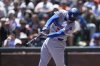 Los Angeles Dodgers' Freddie Freeman hits an RBI double against the San Francisco Giants during the fourth inning of a baseball game in San Francisco, Sunday, July 13, 2025. (AP Photo/Jeff Chiu)