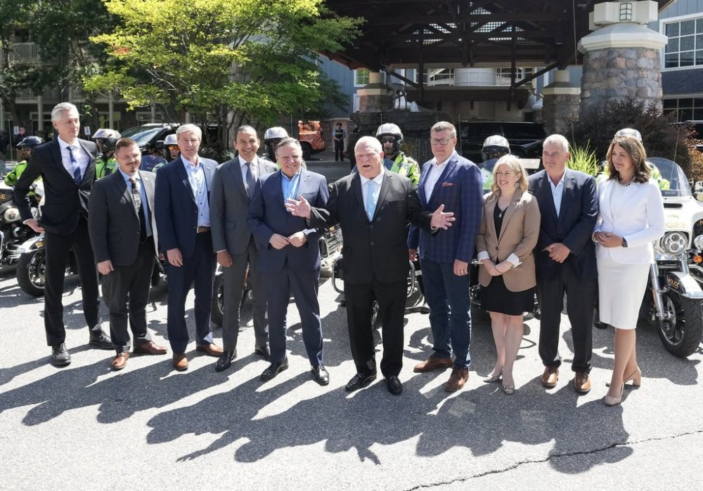 Ontario Premier Doug Ford, centre, welcomes the premiers as they pose for a portrait during the 2025 summer meeting of Canada’s premiers at Deerhurst Resort in Huntsville, Ont., on Monday, July 21, 2025. THE CANADIAN PRESS/Nathan Denette