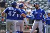 Toronto Blue Jays' Nathan Lukes, right, celebrates with Addison Barger (47) and Bo Bichette (11) after hitting a three-run home run to score them all during the seventh inning of a baseball game against the Baltimore Orioles, Wednesday, July 30, 2025, in Baltimore. (AP Photo/Stephanie Scarbrough)