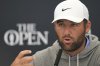 Scottie Scheffler of the United States gestures as he speaks during press conference ahead of the British Open golf championship at the Royal Portrush Golf Club, Northern Ireland, Tuesday, July 15, 2025. The Open starts Thursday. (AP Photo/Francisco Seco)