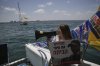Relatives and supporters of Israeli hostages held by Hamas sail along the coast of Israeli southern city of Ashkelon towards the Gaza Strip, in a protest demanding their release from captivity and calling for an end to the war Thursday, Aug. 7, 2025. (AP Photo/Leo Correa)