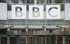 FILE - This photo shows a BBC sign outside the entrance to the headquarters of the publicly funded media organization in London, July 19, 2017. (AP Photo/Frank Augstein, File)