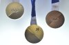 Milano Cortina 2026 Winter Olympics medals are displayed during the unveiling ceremony in Venice, Italy, Tuesday, July 15, 2025. (AP Photo/Luigi Costantini)