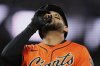 San Francisco Giants' Dominic Smith celebrates after hitting a solo home run during the fifth inning of a baseball game against the Los Angeles Dodgers, Friday, July 11, 2025, in San Francisco. (AP Photo/Godofredo A. Vásquez)