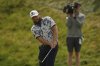 Tyrrell Hatton of England chips onto the 7th green during the second round of the British Open golf championship at the Royal Portrush Golf Club, Northern Ireland, Friday, July 18, 2025. (AP Photo/Francisco Seco)