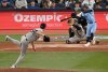 Toronto Blue Jays' Ernie Clement, right, hits an RBI single off New York Yankees starting pitcher Max Fried (54) in fourth inning MLB baseball game action in Toronto on Wednesday, July 23, 2025. THE CANADIAN PRESS/Jon Blacker