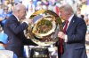 President Donald Trump, right, and FIFA President Gianni Infantino carry the championship trophy at the conclusion of the Club World Cup final soccer match at MetLife Stadium in East Rutherford, N.J., Sunday, July 13, 2025. (AP Photo/Jacquelyn Martin)