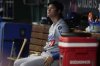 Los Angeles Dodgers' Shohei Ohtani sits in the dugout during the fourth inning of a baseball game against the Cincinnati Reds Wednesday, July 30, 2025, in Cincinnati. (AP Photo/Carolyn Kaster)
