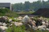 Investigators at the scene of a crash involving two aircraft in Steinbach, Man., Tuesday July 8, 2025. THE CANADIAN PRESS/David Lipnowski