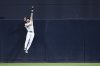 San Diego Padres center fielder Jackson Merrill makes a leaping catch on a ball hit by Arizona Diamondbacks' Corbin Carroll during the fifth inning of a baseball game Tuesday, July 8, 2025, in San Diego. (AP Photo/Orlando Ramirez)