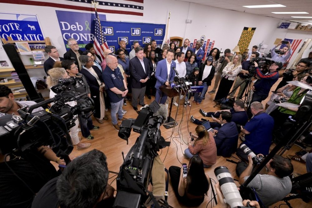 Texas House Democratic Caucus Chair Gene Wu along with other members of the Texas House are joined by Illinois Governor JB Pritzker as they speak about Texas Republican plans to redraw the House map office during a press conference at the Democratic Party of DuPage County office in Carol Stream, IL on Sunday, Aug. 3, 2025. (AP Photo/Mark Black)
