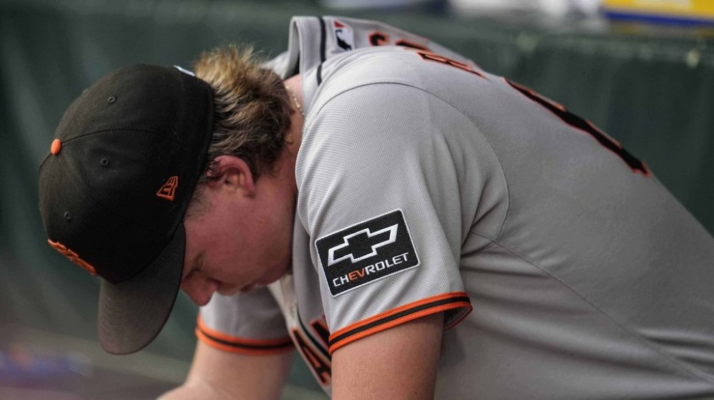 San Francisco Giants pitcher Hayden Birdsong (60) sits in the dugout after being relieved in the first inning of a baseball game against the Atlanta Braves, Monday, July 21, 2025, in Atlanta. (AP Photo/Mike Stewart)