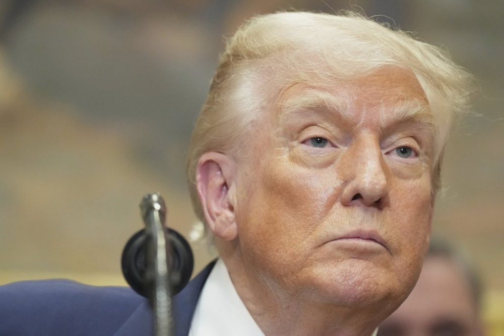 President Donald Trump listens during an event to sign an executive order restarting the Presidential Fitness Test in public schools, Thursday, July 31, 2025, in the Roosevelt Room of the White House in Washington. (AP Photo/Jacquelyn Martin)