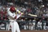 Arizona Diamondbacks' Lourdes Gurriel Jr. connects for a run-scoring single against the San Diego Padres during the fourth inning of a baseball game Monday, Aug. 4, 2025, in Phoenix. (AP Photo/Ross D. Franklin)