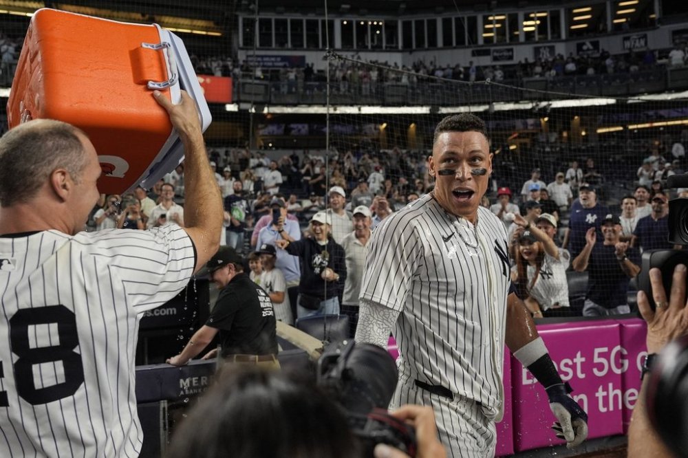 New York Yankees players throw Gatorade on designated hitter Aaron Judge after winning a baseball game against the Seattle Mariners, Thursday, July 10, 2025, in New York. (AP Photo/Yuki Iwamura)