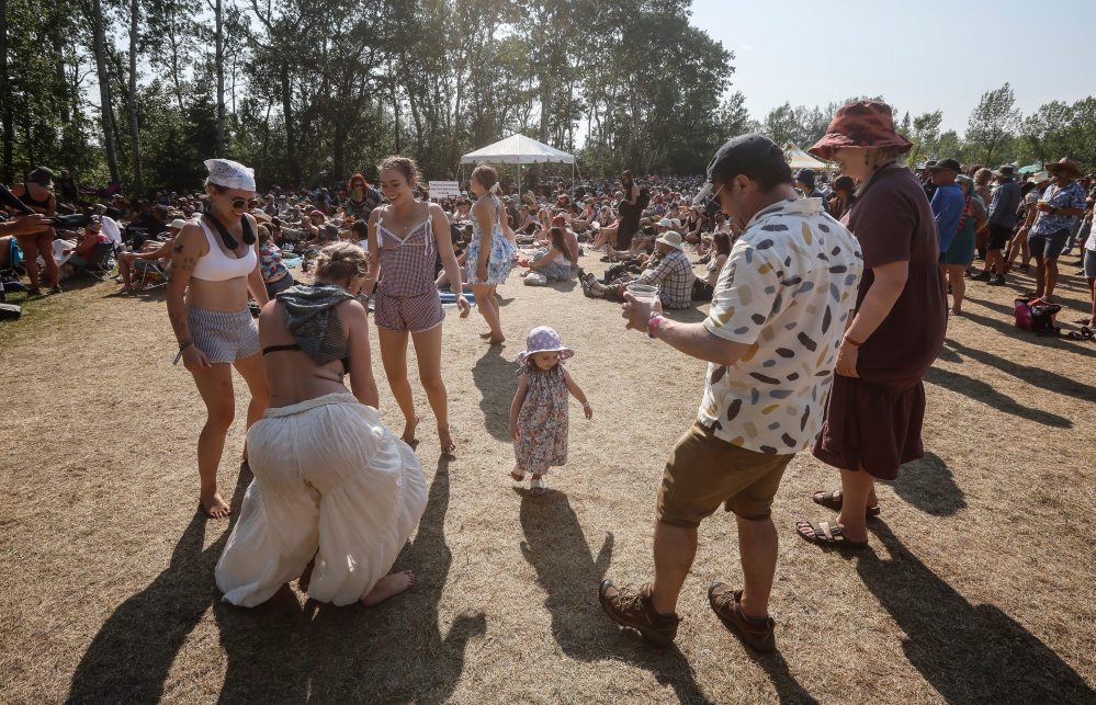 JOHN WOODS / FREE PRESS
People dance at the Folk Festival on Sunday, July 13.
Reporter: ?