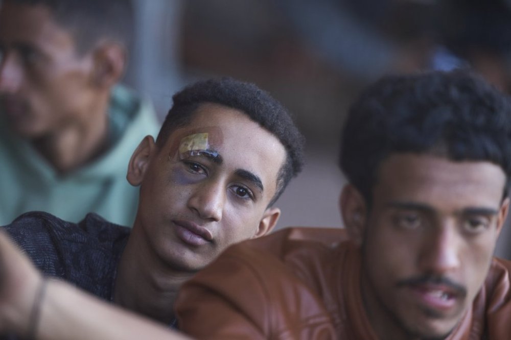 Migrants rescued south of Crete wait to be registered on their arrival at the the port of Lavrio, Greece, on Thursday, July 10, 2025. (AP Photo/Petros Giannakouris)