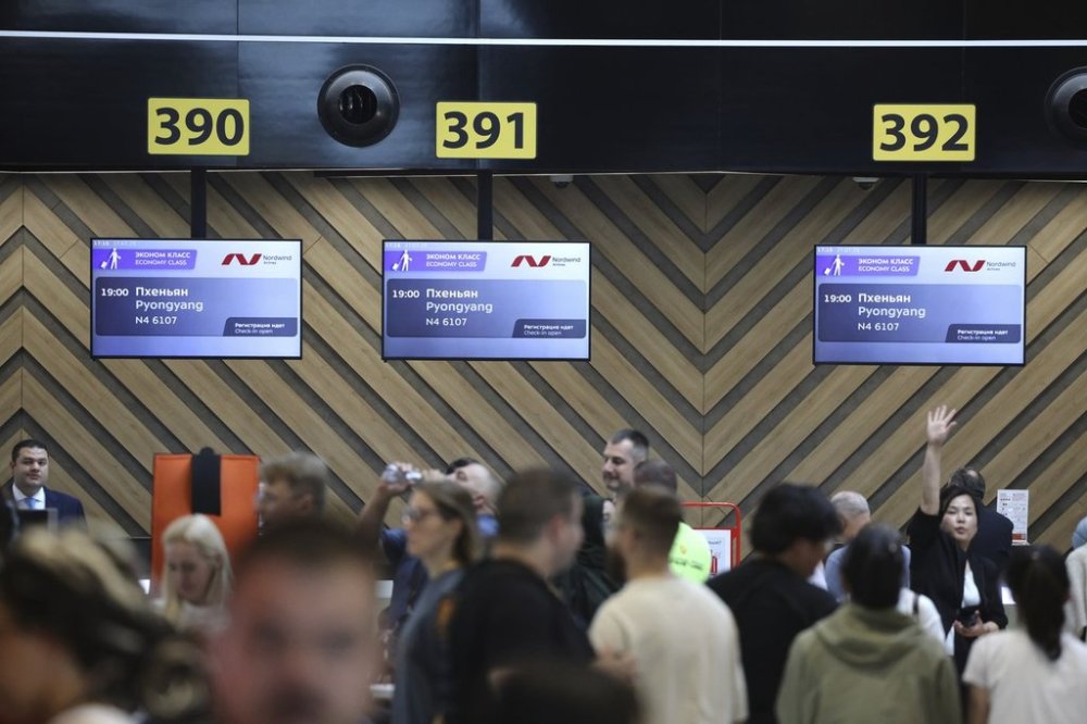 Passengers gather to check-in for the first flight connecting Moscow and Pyongyang at Moscow's Sheremetyevo International airport amidst the warming relations between Russia and North Korea outside Moscow, Russia, Sunday, July 27, 2025. (AP Photo)