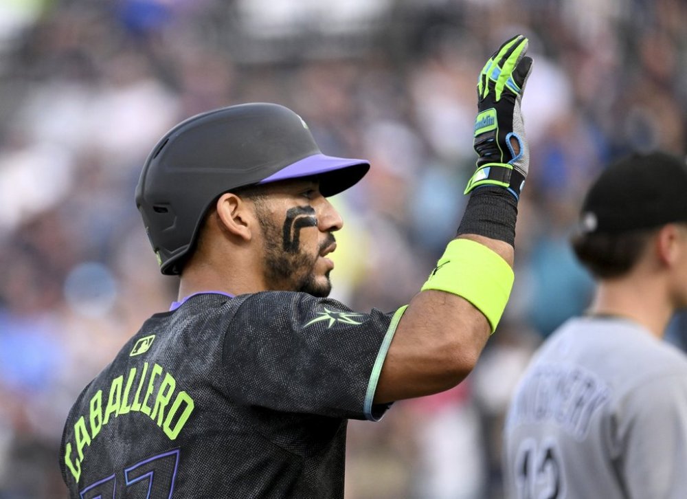 Tampa Bay Rays' José Caballero celebrates after running to third base on a Chicago White Sox error after his single during the second inning of a baseball game Tuesday, July 22, 2025, in Tampa, Fla. (AP Photo/Jason Behnken)