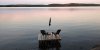 Muskoka chairs sit on a dock looking over Boshkung Lake, in Algonquin Highlands, Ont., Monday, Oct. 5, 2020. THE CANADIAN PRESS/Giordano Ciampini