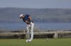 Scottie Scheffler of the United States play his tee shot on the 6th during the final round of the British Open golf championship at the Royal Portrush Golf Club, Northern Ireland, Sunday, July 20, 2025. (AP Photo/Peter Morrison)