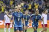 Sweden's Emma Blackstenius, left, celebrates after scoring the opening goal during the Euro 2025, group C, soccer match between Sweden and Poland in Lucerne, Switzerland, Tuesday, July 8, 2025. (Urs Flueeler/Keystone via AP)