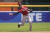 FILE - Arizona Diamondbacks shortstop Nick Ahmed throws out Detroit Tigers' Javier Baez (28) at first during the sixth inning of a baseball game, Saturday, June 10, 2023, in Detroit. (AP Photo/Carlos Osorio, File)