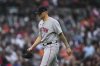 FILE - Boston Red Sox pitcher Tanner Houck walks to the dugout after being pulled against the Detroit Tigers in the third inning during a baseball game, May 12, 2025, in Detroit. (AP Photo/Paul Sancya, File)