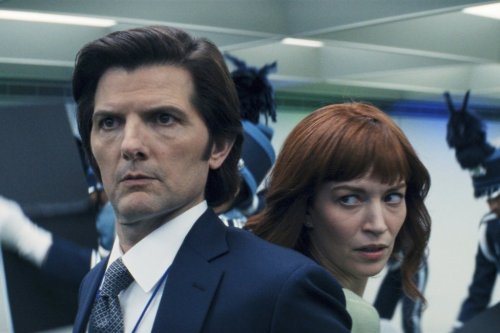 This image released by Apple TV+. shows Adam Scott, left, and Britt Lower in a scene from 