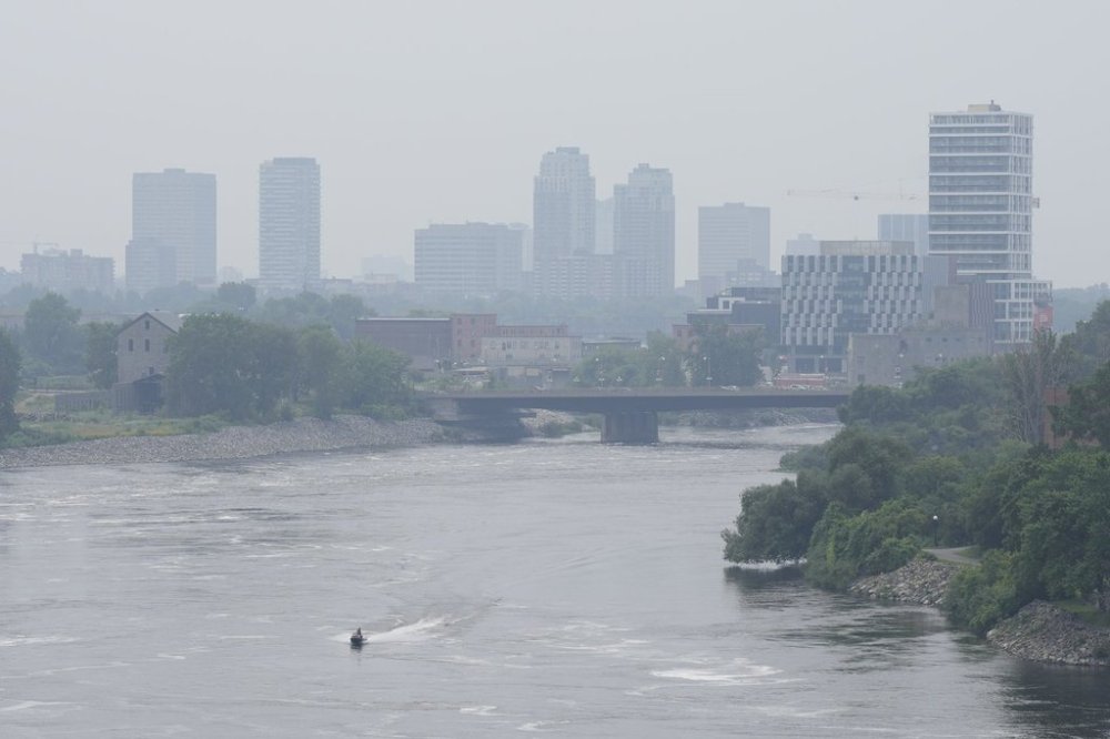 A watercraft makes its way along the Ottawa river in Ottawa on Monday, July 14, 2025. THE CANADIAN PRESS/Adrian Wyld