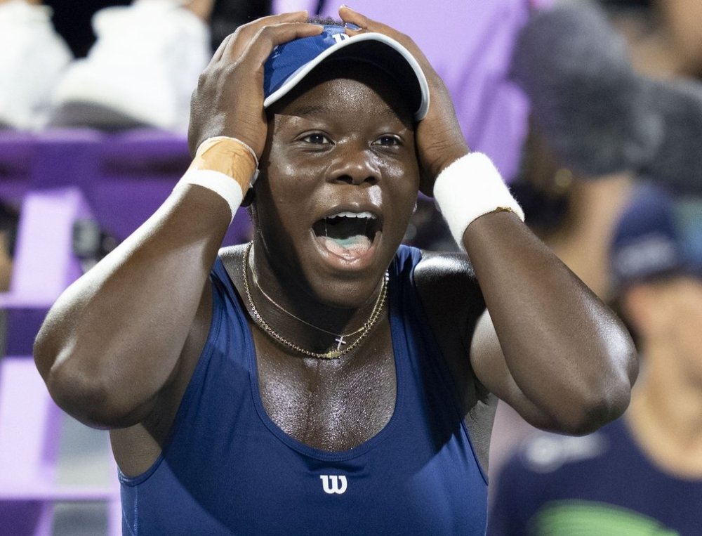 Victoria Mboko of Canada reacts following her win over Elena Rybakina of Kazakhstan during semifinal tennis action at the National Bank Open in Montreal, Wednesday, Aug. 6, 2025. THE CANADIAN PRESS/Christinne Muschi