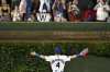 Chicago Cubs outfielder Pete Crow-Armstrong (4) greets fans after a baseball game against the Boston Red Sox, Saturday, July 19, 2025, in Chicago. (AP Photo/Matt Marton)