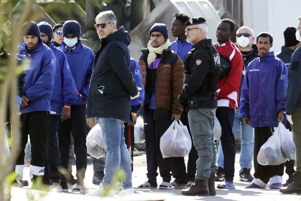 FILE - Migrants follow the authorities after their arrival in the port of Shengjin, northwestern Albania, Jan. 28, 2025. (AP Photo/Vlasov Sulaj, File)