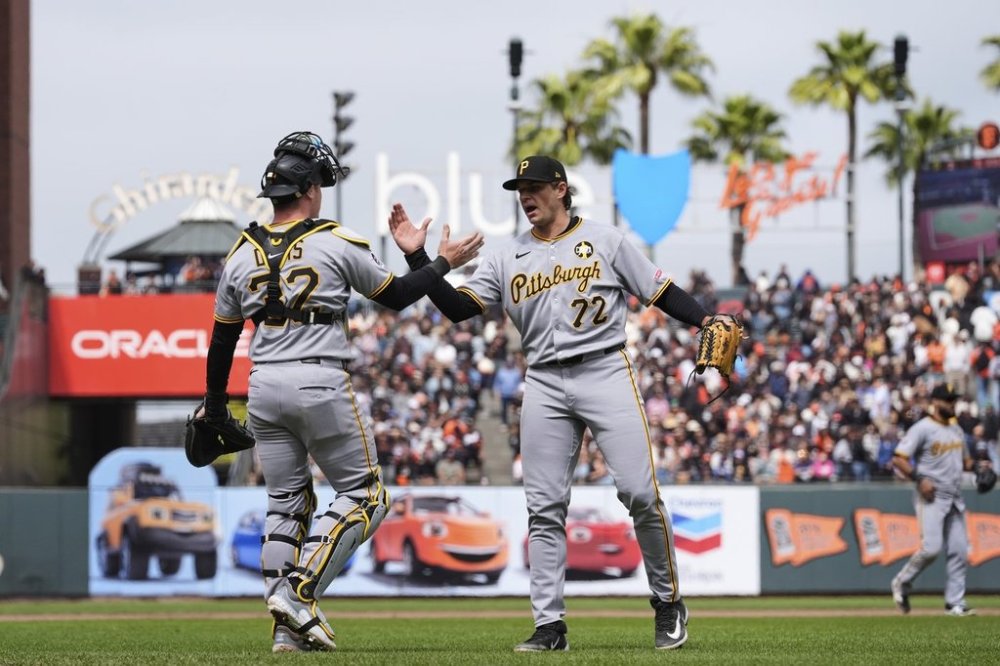 Pittsburgh Pirates pitcher Isaac Mattson, right, and catcher Henry Davis celebrate after the team's victory over the San Francisco Giants in a baseball game Wednesday, July 30, 2025, in San Francisco. (AP Photo/Godofredo A. Vásquez)