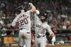 Houston Astros' Brice Matthews (28) celebrates his two-run home run against the Arizona Diamondbacks with Astros' Chas McCormick (20) during the seventh inning of a baseball game Monday, July 21, 2025, in Phoenix. (AP Photo/Ross D. Franklin)