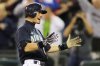 FILE - Seattle Mariners Ichiro Suzuki celebrates after he hit a two-run home run in the ninth inning to give the Mariners a 3-2 win over the New York Yankees in a baseball game, Friday, Sept. 18, 2009, in Seattle. (AP Photo/Ted S. Warren, File)