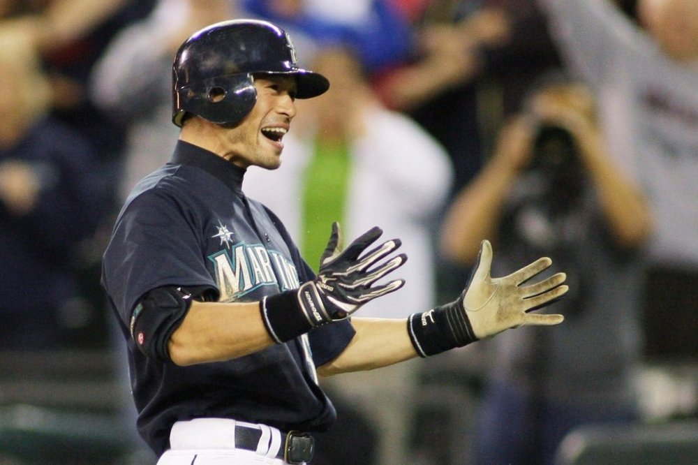 FILE - Seattle Mariners Ichiro Suzuki celebrates after he hit a two-run home run in the ninth inning to give the Mariners a 3-2 win over the New York Yankees in a baseball game, Friday, Sept. 18, 2009, in Seattle. (AP Photo/Ted S. Warren, File)