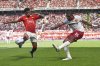 FILE - West Ham's Mohammed Kudus, right, kicks the ball ahead of Manchester United's Amad Diallo during the English Premier League soccer match at Old Trafford stadium in Manchester, England, May 11, 2025. (AP Photo/Ian Hodgson, File)