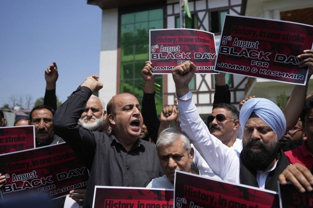 Supporters of India's opposition Congress party shout slogans demanding the ruling government restore the statehood of the disputed region, in Srinagar, Indian-controlled Kashmir, Tuesday, Aug 5, 2025. (AP Photo/Mukhtar Khan)