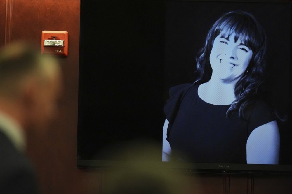 Prosecutor Michael Mauro, front, makes a point during closing arguments as an image of Angela Craig is cast on a screen in the murder trial of dentist James Craig, who is accused of killing his wife Angela, in district court in Arapahoe County Tuesday, July 29, 2025, in Centennial, Colo. (AP Photo/David Zalubowski, Pool)