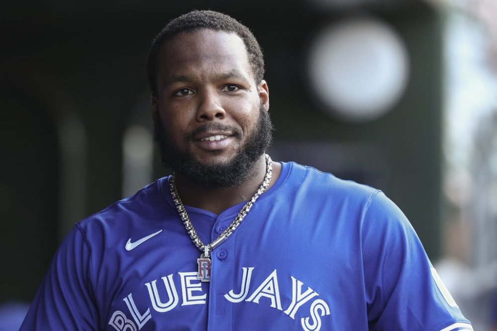 Toronto Blue Jays first baseman Vladimir Guerrero Jr. gets ready in the dugout before a baseball game against the Athletics Saturday, July 12, 2025, in West Sacramento, Calif. (AP Photo/Sara Nevis)