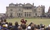 FILE -Tiger Woods of the United States tees off from the 18th towards the club house of the Royal and Ancient during the British Open golf championship on the Old Course at St. Andrews in Scotland, July 23, 2000. (AP Photo/Alastair Grant, File)
