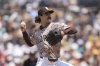 San Diego Padres starting pitcher Dylan Cease works against a St. Louis Cardinals batter during the second inning of a baseball game Sunday, Aug. 3, 2025, in San Diego. (AP Photo/Gregory Bull)
