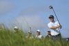 Justin Rose of England plays his tee shot off the 2nd hole during a practice round for the British Open golf championship at the Royal Portrush Golf Club, Northern Ireland, Wednesday, July 16, 2025. (AP Photo/Jon Super)