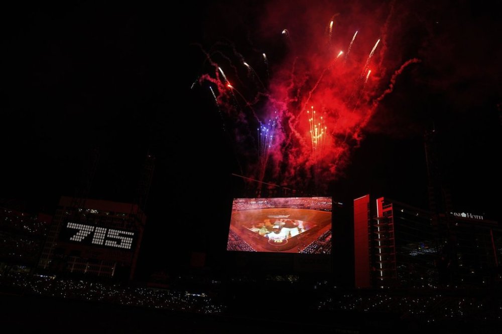 Fans, watch a Hank Aaron Memorial during the MLB baseball All-Star game between the American League and National League, Tuesday, July 15, 2025, in Atlanta. (AP Photo/Brynn Anderson)