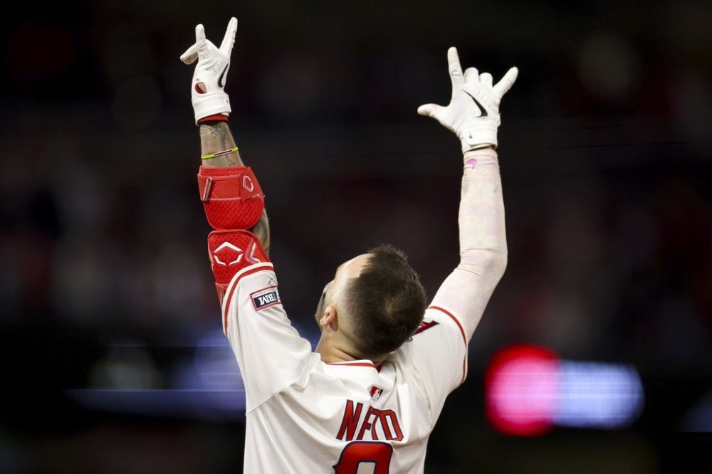 Los Angeles Angels' Zach Neto celebrates after driving in the winning run during the tenth inning of a baseball game against the Seattle Mariners Friday, July 25, 2025, in Anaheim, Calif. (AP Photo/Eric Thayer)